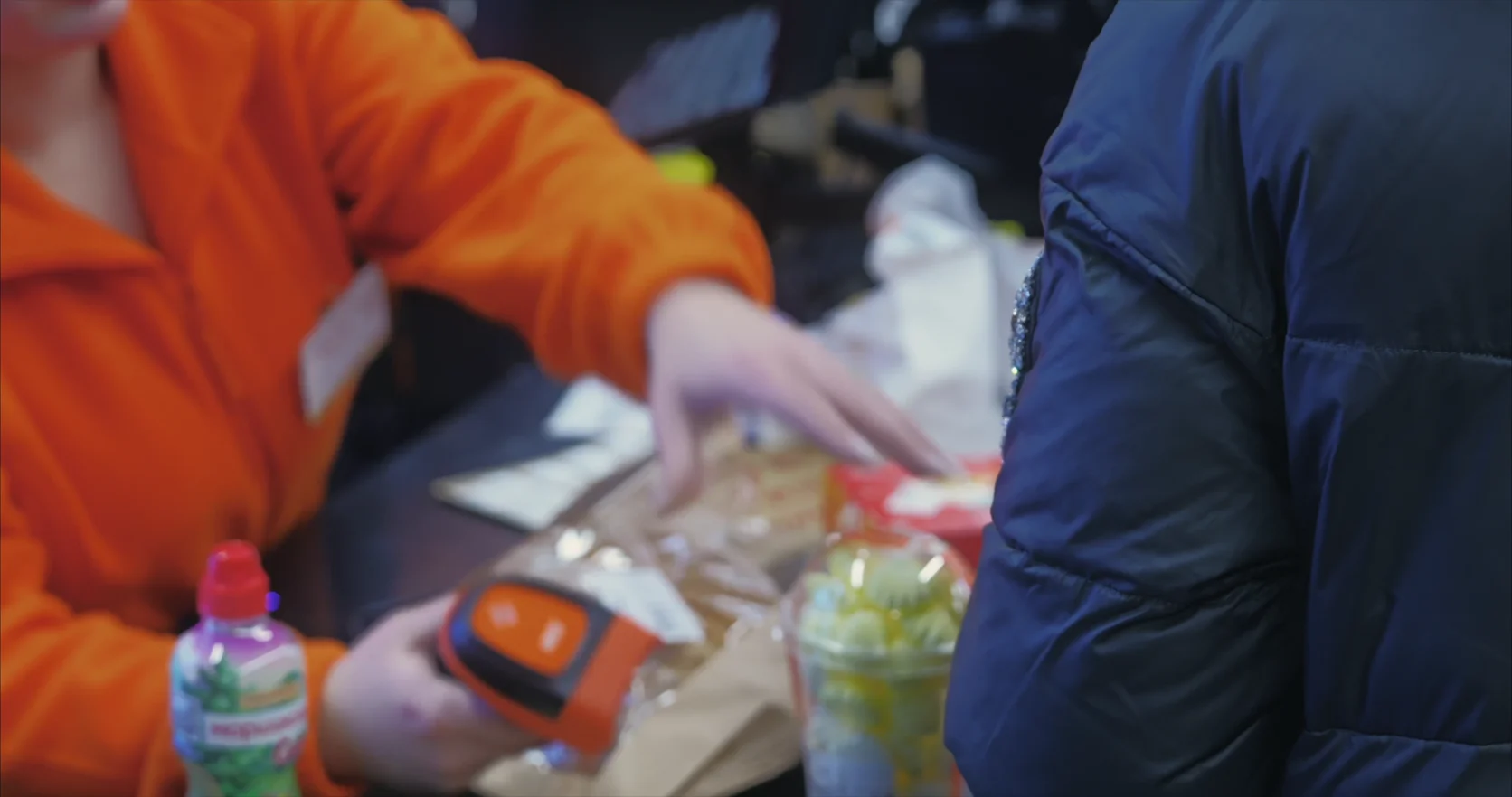 Groceries being scanned at a store checkout