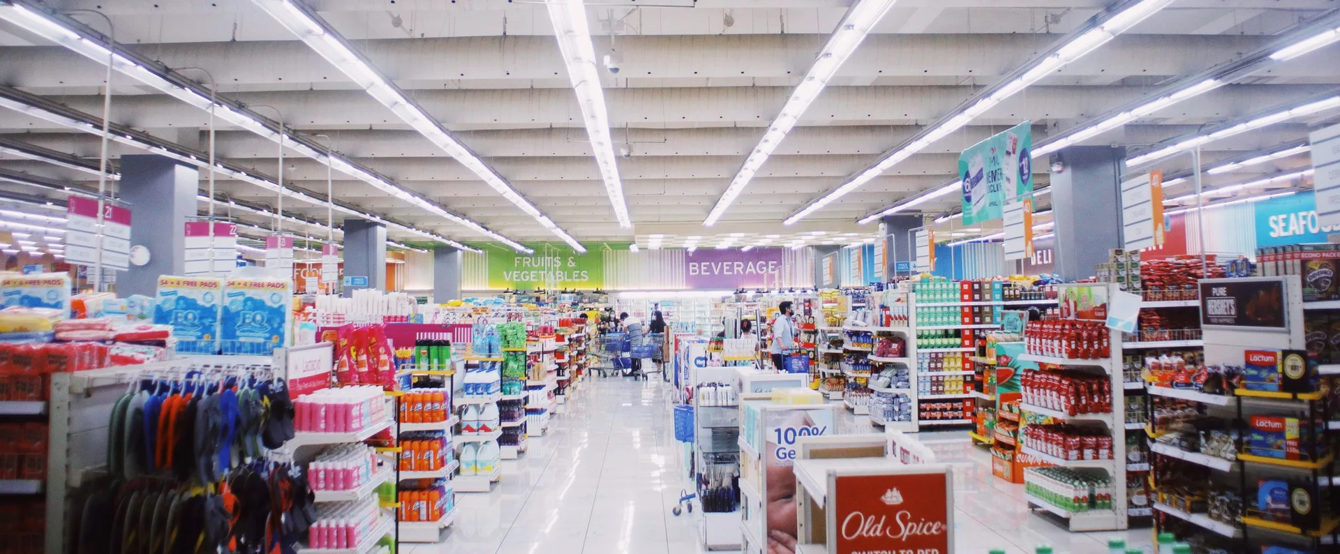 Packaged products and everyday essentials on supermarket shelves